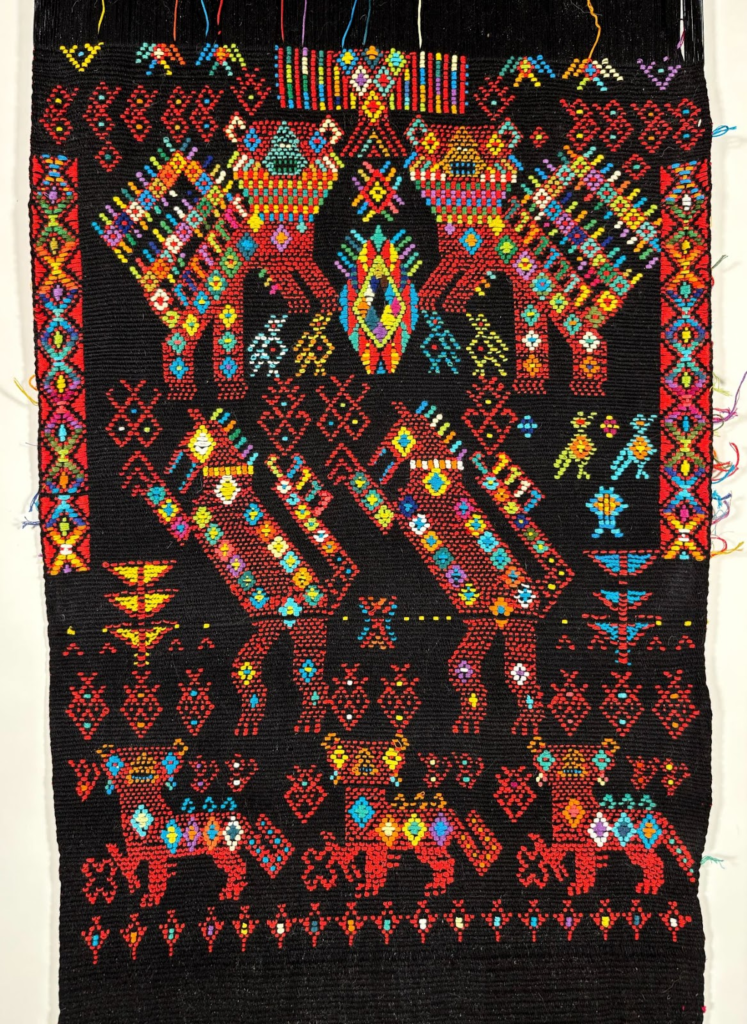 A close-up of another of Charlie's intricate work on his self-built backstrap loom. Untitled.